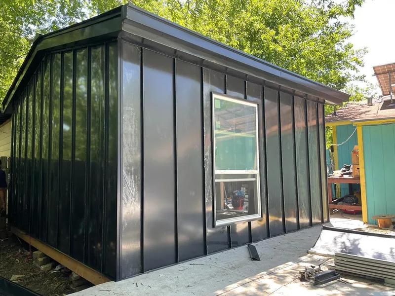 Black standing seam metal wall panels for Roof Inspection in Leighton